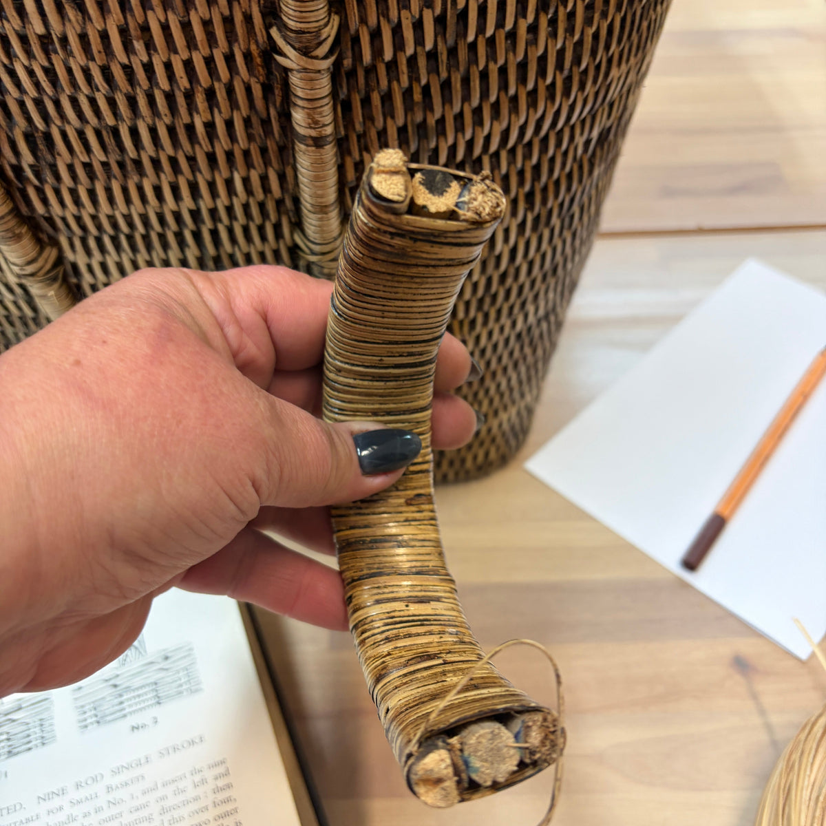 hands repairing broken basket