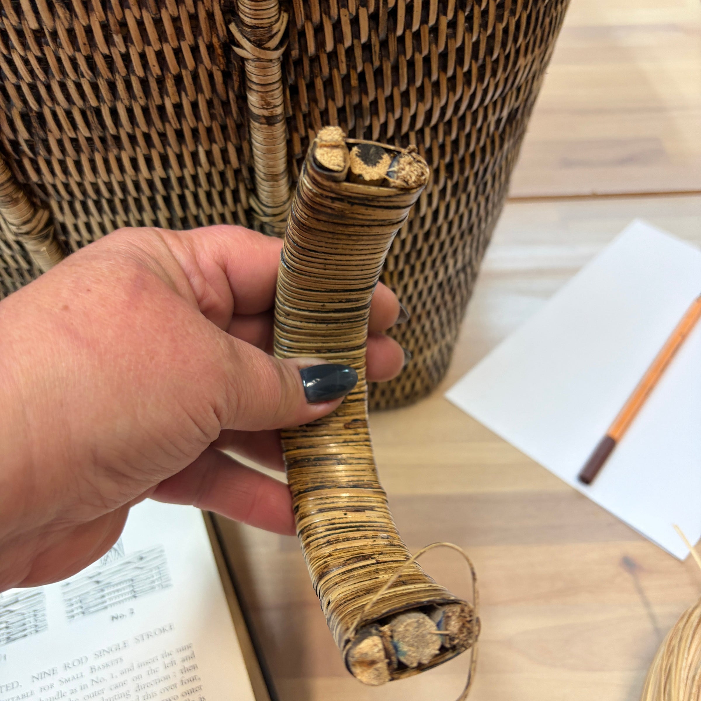 hands repairing broken basket